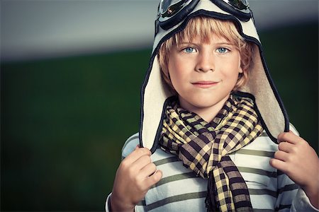 pilots with scarves - Boy in helmet and glasses in the field Stock Photo - Budget Royalty-Free & Subscription, Code: 400-07169517