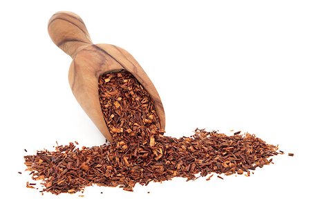 Rooibos herbal tea in an olive wood scoop over white background. Stock Photo - Budget Royalty-Free & Subscription, Code: 400-07169579