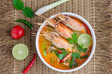 Tom yam kung or Tom yum, Tom yam is a spicy clear soup typical in Thailand and No.1 Thai Dish Cuisine. Stockbilder - Microstock & Abonnement, Bildnummer: 400-07174098