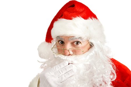 simsearch:640-02953152,k - Closeup of Santa Clause covering his mouth like he has a secret he can't tell.  Isolated on white. Photographie de stock - Aubaine LD & Abonnement, Code: 400-07174147