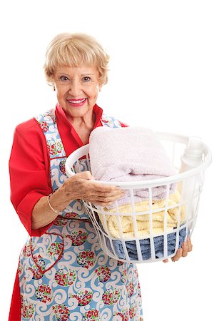 simsearch:640-03260502,k - Beautiful senior woman in her apron, doing the laundry.  Isolated on white. Stock Photo - Budget Royalty-Free & Subscription, Code: 400-07174150