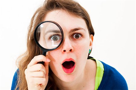 simsearch:400-04554899,k - woman with magnifying glass on a white background Stock Photo - Budget Royalty-Free & Subscription, Code: 400-07174628