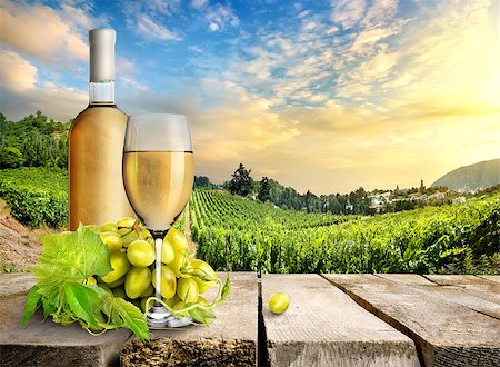 simsearch:400-07829164,k - Wine with grape on a background of vineyard Stock Photo - Budget Royalty-Free & Subscription, Code: 400-07174802
