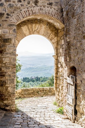 Archway in San Quirico with view to the Tuscan landscape in Tuscany, Italy Stock Photo - Budget Royalty-Free & Subscription, Code: 400-07175188