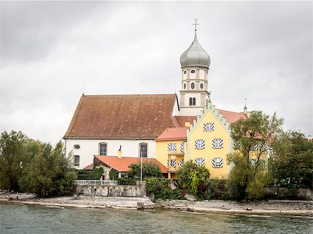 rain on roof - Picture of the church Sanct Georg in Wasserburg at the lake Bodensee on a cloudy and rainy day Stock Photo - Budget Royalty-Free & Subscription, Code: 400-07175198