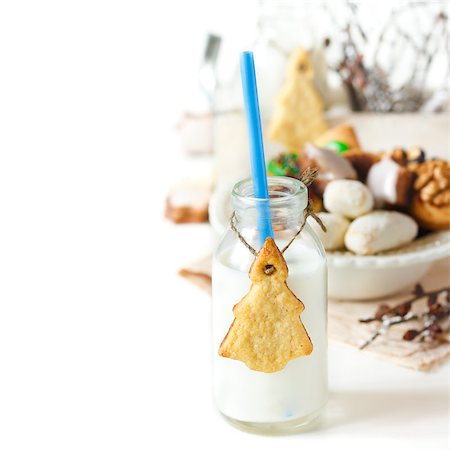 simsearch:640-02772614,k - Christmas tree cookies and milk on a white background. Stock Photo - Budget Royalty-Free & Subscription, Code: 400-07175458