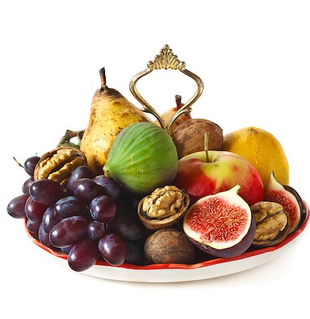 simsearch:824-02888213,k - Delicious ripe fruits and nuts on a dessert plate. Foto de stock - Royalty-Free Super Valor e Assinatura, Número: 400-07175483