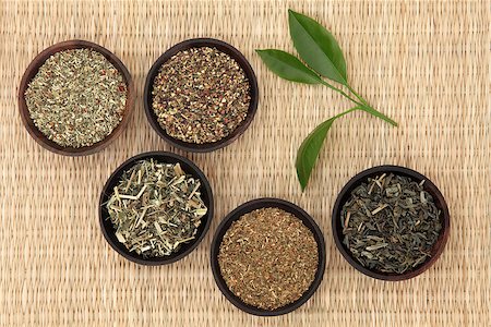 simsearch:400-07175956,k - Green tea leaf selection of ginseng, jasmine, st johns wort, nettle and peppermint over wicker background. Stock Photo - Budget Royalty-Free & Subscription, Code: 400-07175933