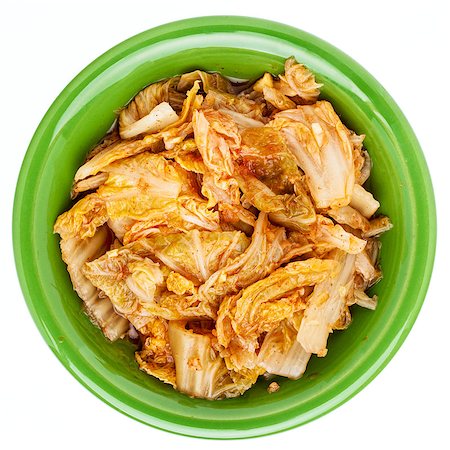 simsearch:400-08342479,k - fermented napa cabbage with garlic and onion - a tradition Korean kimchi dish in a small ceramic bowl, isolated on white Stock Photo - Budget Royalty-Free & Subscription, Code: 400-07176424