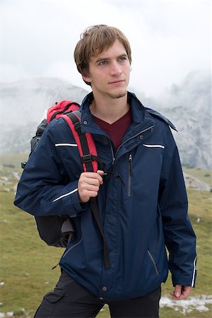 simsearch:400-07176526,k - Portrait of a young man hiking in the mountains Alps Italy Stock Photo - Budget Royalty-Free & Subscription, Code: 400-07176533