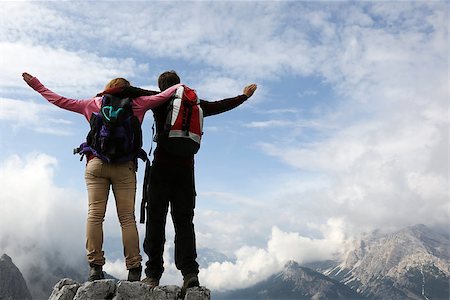 Two young mountaineers standing on mountain top and enjoying their success Stock Photo - Budget Royalty-Free & Subscription, Code: 400-07176545