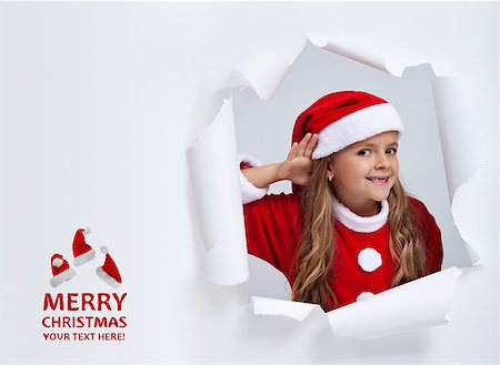 Santa hears your christmas wishes - little girl eavesdropping on your dreams, with copy space Photographie de stock - Aubaine LD & Abonnement, Code: 400-07176681