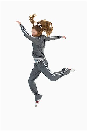 Full length side view of a sporty young blond jumping over white background Foto de stock - Royalty-Free Super Valor e Assinatura, Número: 400-07177216