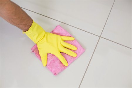 simsearch:400-07178079,k - Close up of yellow gloved hand with cleaning rag wiping the floor at home Foto de stock - Super Valor sin royalties y Suscripción, Código: 400-07178077