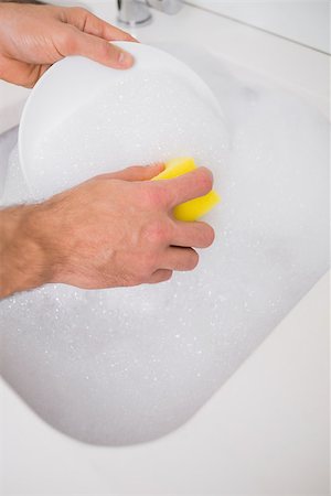 Close up of a man's hands doing the dishes at kitchen sink in the house Stock Photo - Budget Royalty-Free & Subscription, Code: 400-07178103