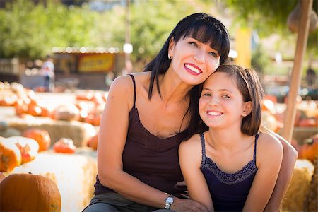 simsearch:400-07179959,k - Attractive Mother and Baby Daughter Portrait in a Rustic Ranch Setting at the Pumpkin Patch. Stockbilder - Microstock & Abonnement, Bildnummer: 400-07179068