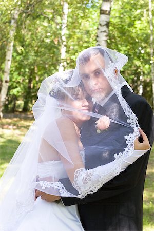 simsearch:400-04382275,k - a groom and a bride are hiden in the veil Stock Photo - Budget Royalty-Free & Subscription, Code: 400-07179298