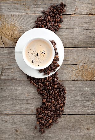 simsearch:400-07306295,k - Coffee cup and beans on wooden table background Foto de stock - Super Valor sin royalties y Suscripción, Código: 400-07179461