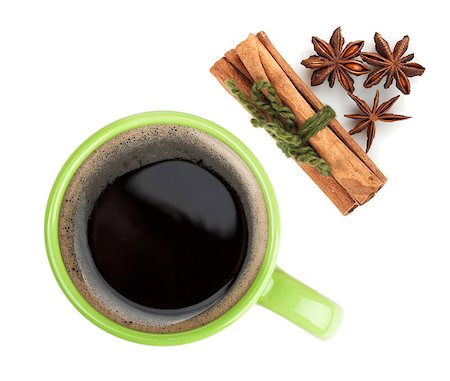 simsearch:400-07299272,k - Green coffee cup with cinnamon and anise. View from above. Isolated on white background Fotografie stock - Microstock e Abbonamento, Codice: 400-07179472