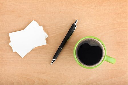 simsearch:400-06462302,k - Blank business cards with pen and coffee cup on wooden office table Stock Photo - Budget Royalty-Free & Subscription, Code: 400-07179496