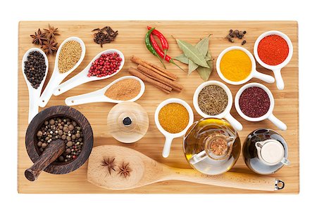 Various spices selection on cutting board. Isolated on white background Stock Photo - Budget Royalty-Free & Subscription, Code: 400-07179678