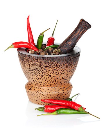 Mortar and pestle with red hot chili pepper and peppercorn. Isolated on white background Stock Photo - Budget Royalty-Free & Subscription, Code: 400-07179683