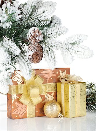 simsearch:400-07450793,k - Gift box and christmas decor under snowy fir tree. Isolated on white background Stock Photo - Budget Royalty-Free & Subscription, Code: 400-07179706