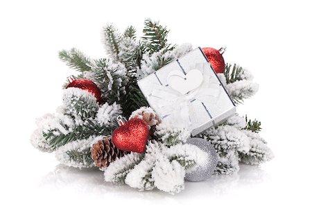 simsearch:400-07450793,k - Gift box and christmas decor on snowy fir tree. Isolated on white background Stock Photo - Budget Royalty-Free & Subscription, Code: 400-07179717