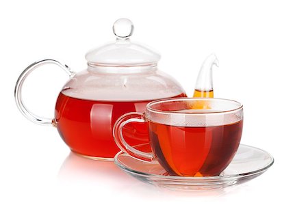 simsearch:400-06554630,k - Glass cup and teapot of black tea. Isolated on white background Stock Photo - Budget Royalty-Free & Subscription, Code: 400-07179718