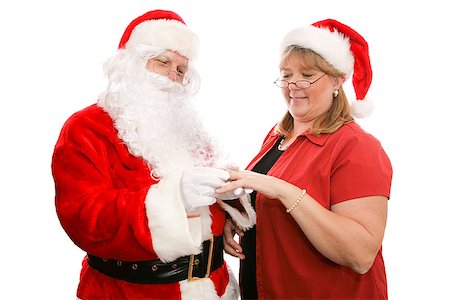 Santa Clause giving his wife a beautiful diamond ring for Christmas.  Isolated on white. Stock Photo - Budget Royalty-Free & Subscription, Code: 400-07179994