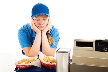 simsearch:400-06333337,k - Unhappy teenage girl has a boring job serving fast food.  Isolated on white. Photographie de stock - Aubaine LD & Abonnement, Code: 400-07179992
