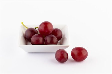 grape berries in a small square white bowl on a white background Stock Photo - Budget Royalty-Free & Subscription, Code: 400-07170353
