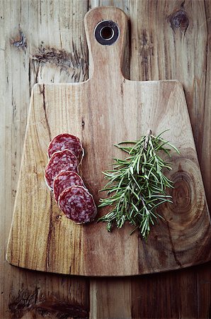 Salami and rosemary on a kitchen board; top view Stock Photo - Budget Royalty-Free & Subscription, Code: 400-07170576