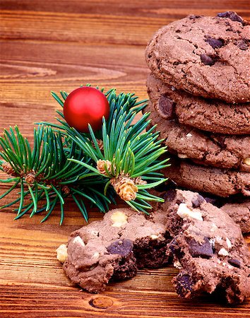 simsearch:400-07420117,k - Stack of Delicious Christmas Chocolate Cookies with Green Spruce Branch and Red Bauble closeup on Wooden background Stock Photo - Budget Royalty-Free & Subscription, Code: 400-07170768