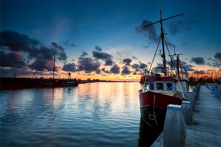 fishing ships at sunset in Zoutkamp, Netherlands Stock Photo - Budget Royalty-Free & Subscription, Code: 400-07170894