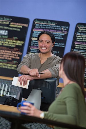 restaurant server order - Handsome cafe owner behind counter with customer Stock Photo - Budget Royalty-Free & Subscription, Code: 400-07171282