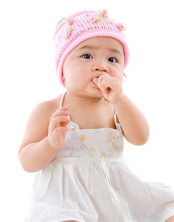 simsearch:400-06389659,k - Portrait of cute Asian baby girl, eating on her own,  isolated on white background Stock Photo - Budget Royalty-Free & Subscription, Code: 400-07171478