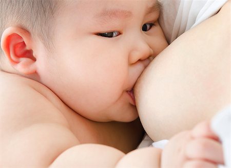 simsearch:695-05778625,k - Mother and baby. Close up Asian mother breastfeeding baby boy Stock Photo - Budget Royalty-Free & Subscription, Code: 400-07171483