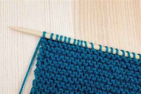 sarahdoow (artist) - Length of garter stitch in blue yarn on knitting needle, on wooden background Stock Photo - Budget Royalty-Free & Subscription, Code: 400-07171740