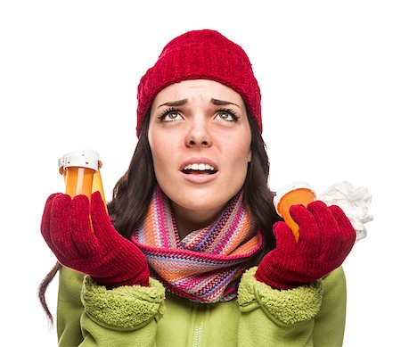 female coughing - Sick Mixed Race Woman Wearing Winter Hat and Gloves with a Tissue Holding Empty Medicine Bottle Isolated on White. Stock Photo - Budget Royalty-Free & Subscription, Code: 400-07172152
