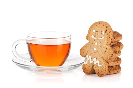 simsearch:400-06554630,k - Glass cup of black tea with homemade cookies and gingerbread man. Isolated on white background Stock Photo - Budget Royalty-Free & Subscription, Code: 400-07172505