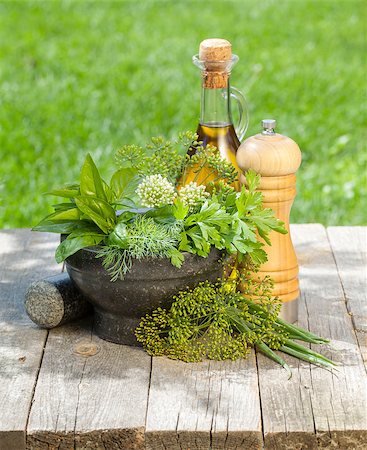 simsearch:400-04348087,k - Fresh herbs in mortar on garden table Stock Photo - Budget Royalty-Free & Subscription, Code: 400-07172570