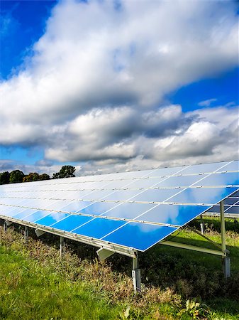 panel solar - Solar Panel on a green meadow with blue sky and white clouds Stock Photo - Budget Royalty-Free & Subscription, Code: 400-07172941