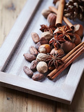 rustic tray - Spices, nuts and cocoa beans for christmas baking Stock Photo - Budget Royalty-Free & Subscription, Code: 400-07173173