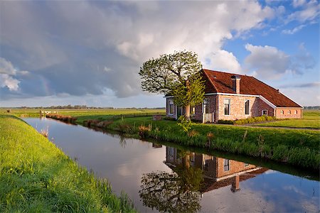 simsearch:400-08997106,k - cozy and charming farmhouse by river, Groningen, Netherlands Stock Photo - Budget Royalty-Free & Subscription, Code: 400-07173539