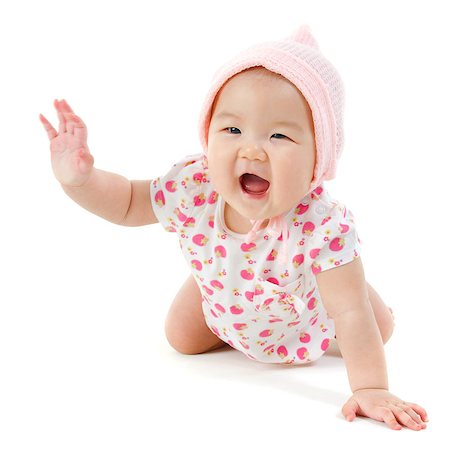 simsearch:400-07173561,k - Six months old Asian baby girl crawling over white background, isolated. Foto de stock - Royalty-Free Super Valor e Assinatura, Número: 400-07173560