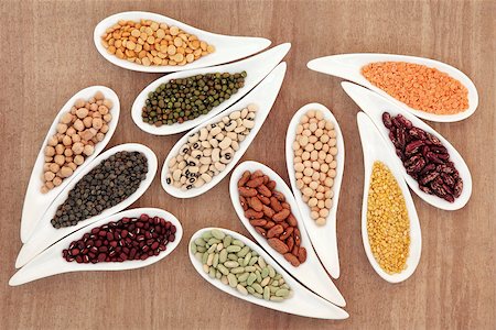 Dried pulses selection in white porcelain dishes over papyrus background. Stock Photo - Budget Royalty-Free & Subscription, Code: 400-07173626