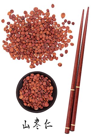 simsearch:400-07169572,k - Jujube seed used in traditional chinese herbal medicine with mandarin title script translation and chopsticks.  Suan zao ren. Zizyphus spinosa semen. Foto de stock - Super Valor sin royalties y Suscripción, Código: 400-07173621