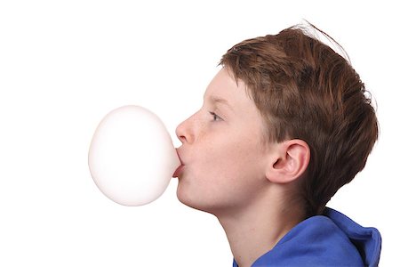 Young boy with a bubble of chewing gum on white background Stock Photo - Budget Royalty-Free & Subscription, Code: 400-07173709