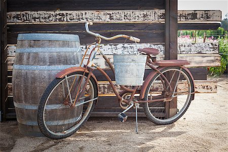 Old Rusty Antique Bicycle and Wine Barrel in a Rustic Outdoor Setting. Stock Photo - Budget Royalty-Free & Subscription, Code: 400-07173760
